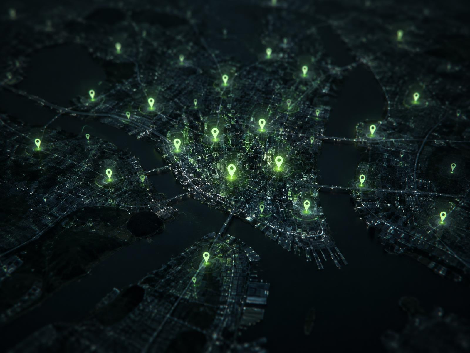 Night map of a city with glowing pins marking available local professionals